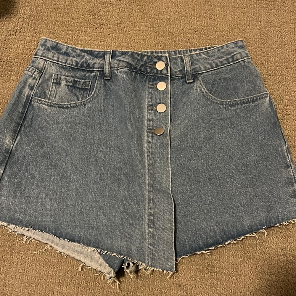 Never been worn denim shorts with front skirt flap
